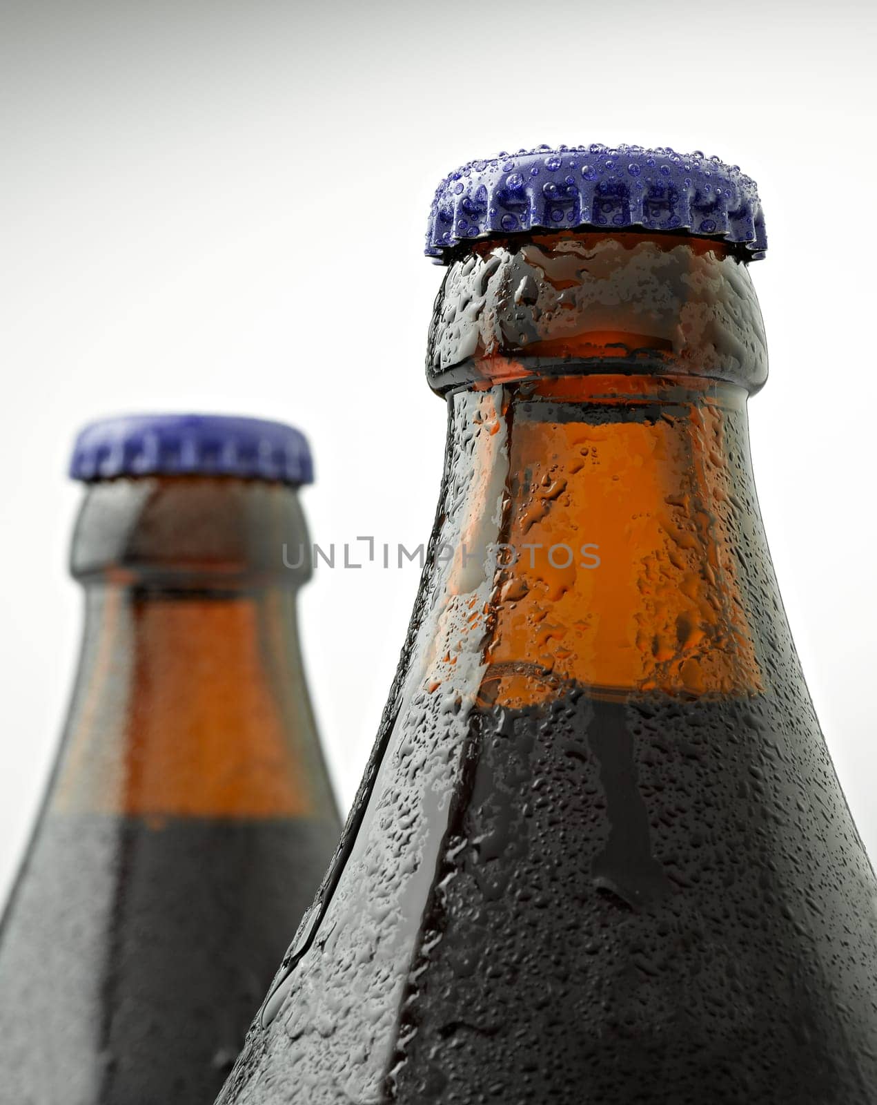 A cap of beer bottle covered with water drops