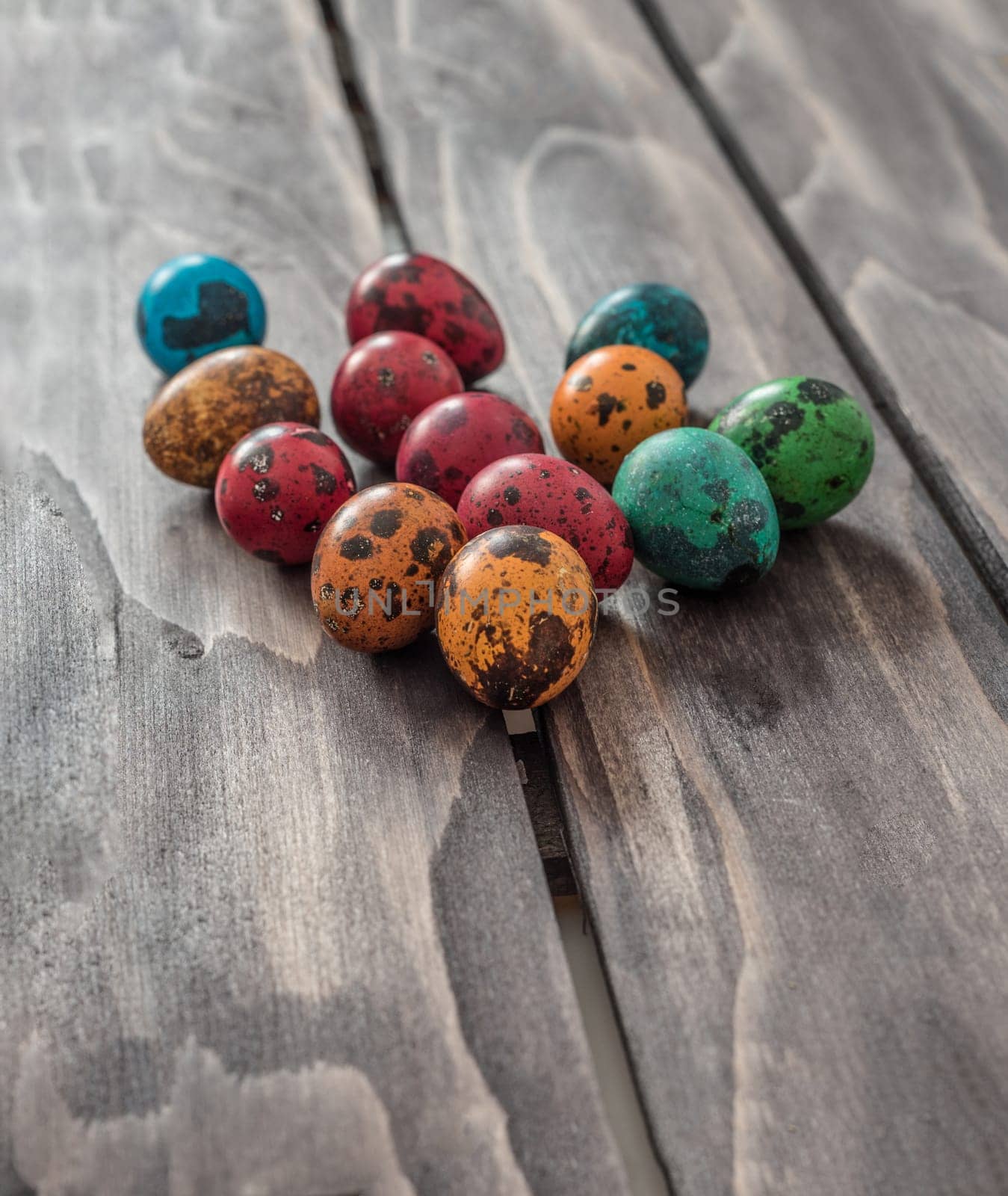 Easter concept. Quail eggs  on wooden background.Selective focus