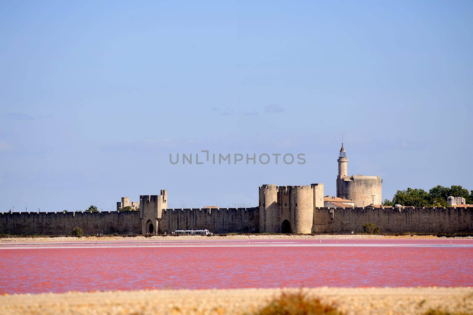 The ramparts of the walled city of Aigues-Mortes seen pink salt