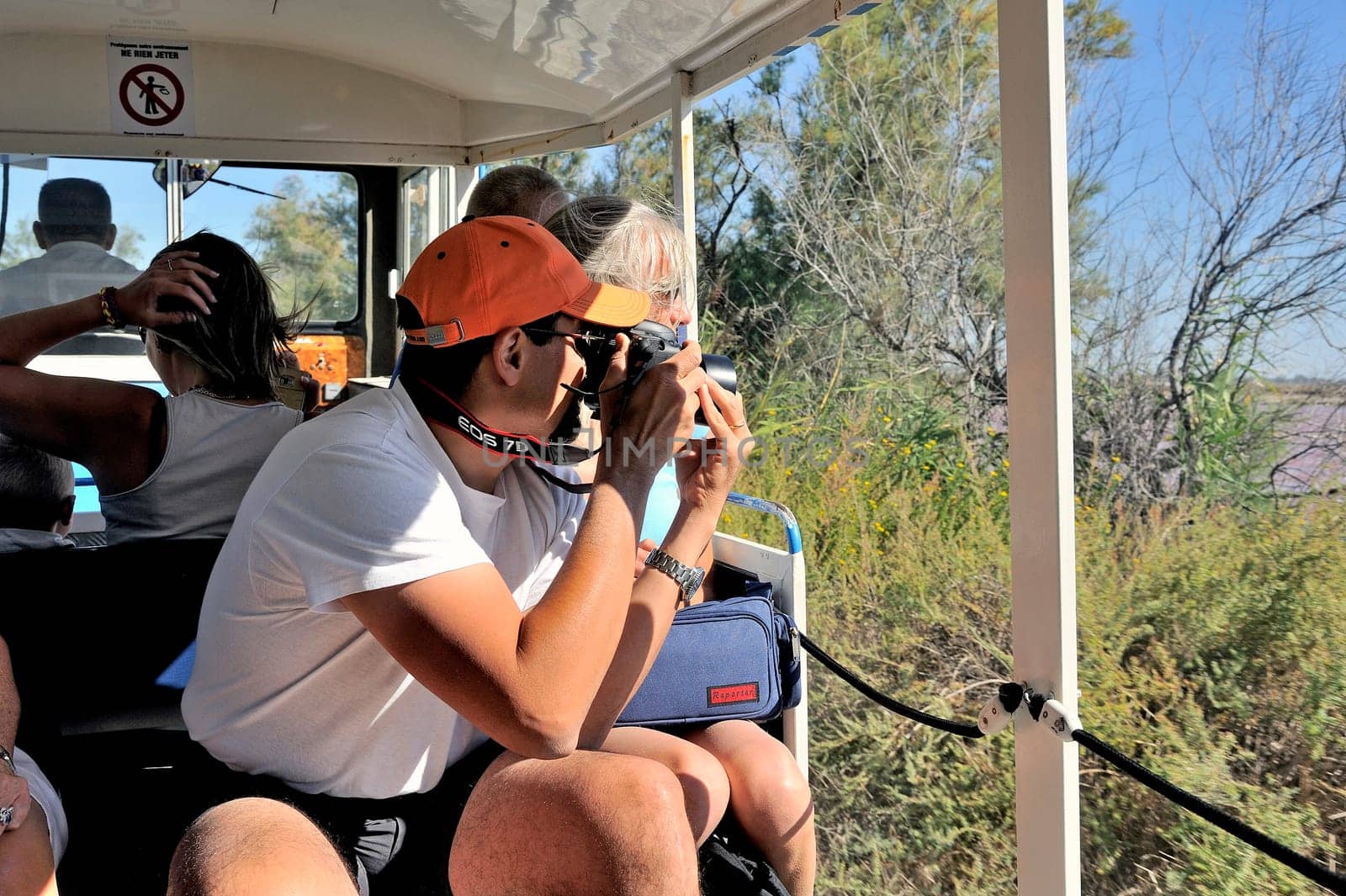 tourists in the tourist train to visit the salt business of Aigues-Mortes and to tour the mine salt site.