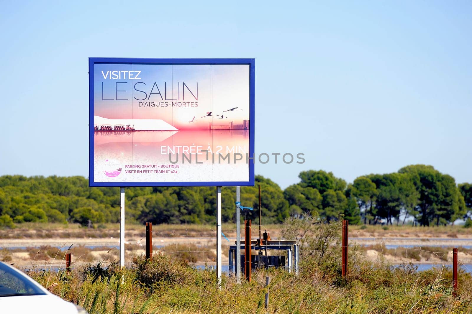 billboard saline Aigues-Mortes in Camargue to announce that tourists can visit the industrial enterprise.