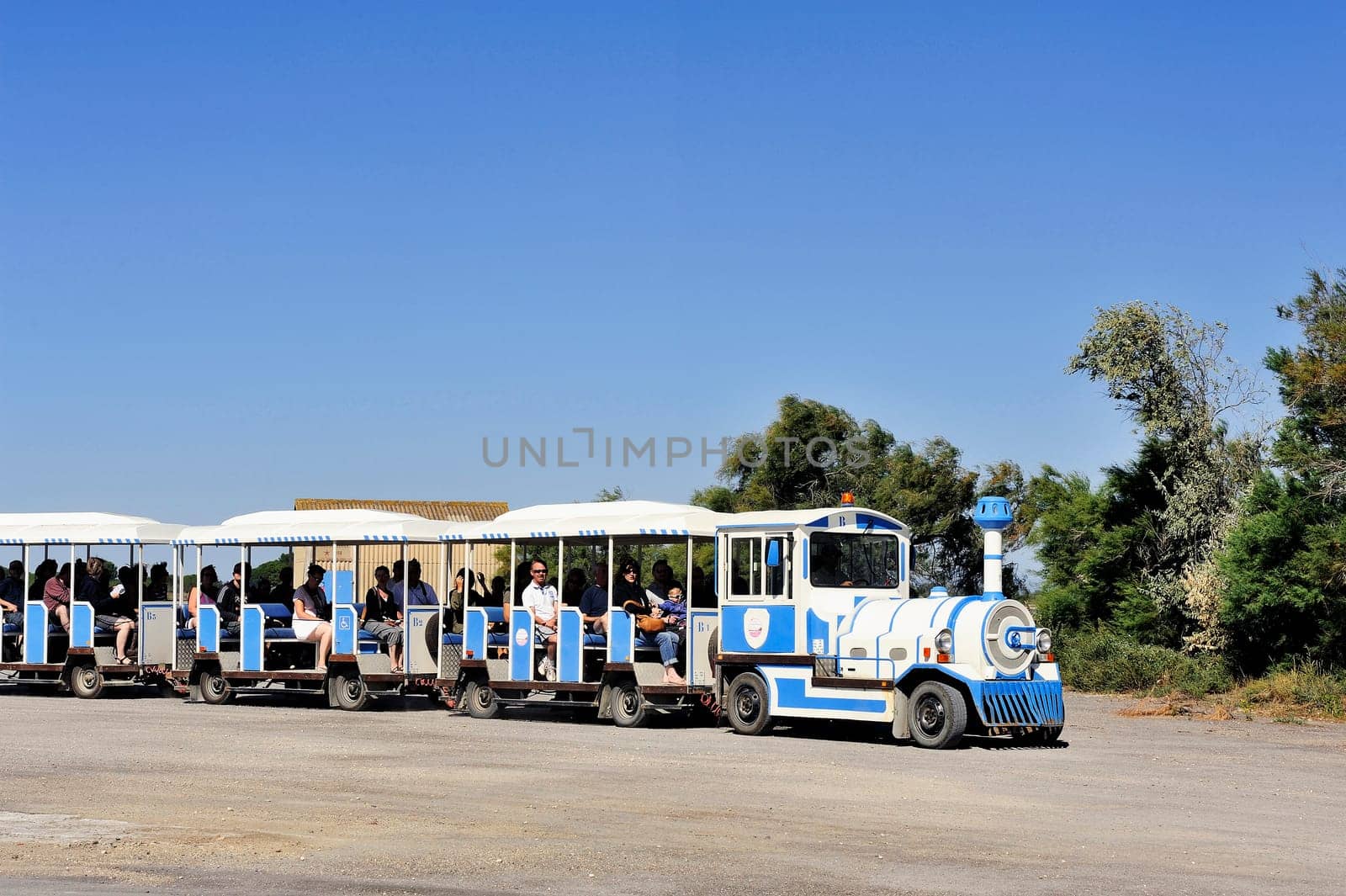 tourists in the tourist train to visit the salt business of Aigues-Mortes and to tour the mine salt site.