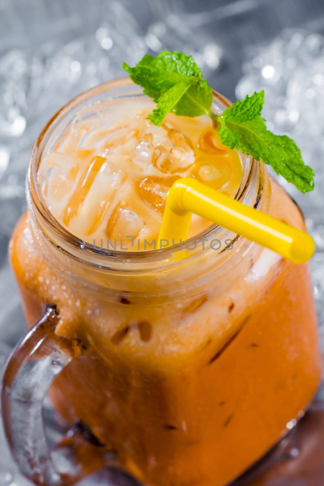 thai ice tea with milk in pitcher