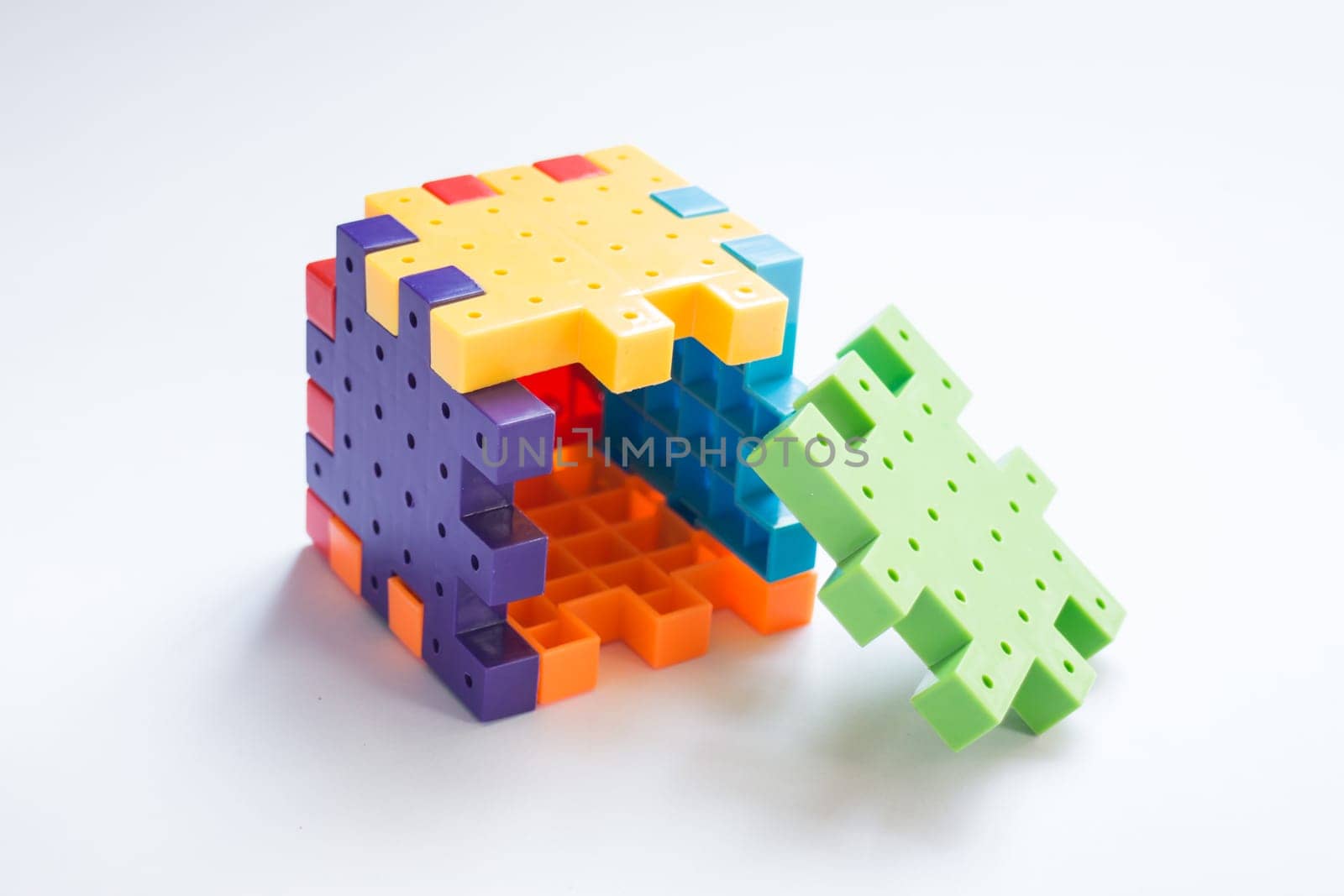 Colorful plastic jigsaw puzzle game, stock photo