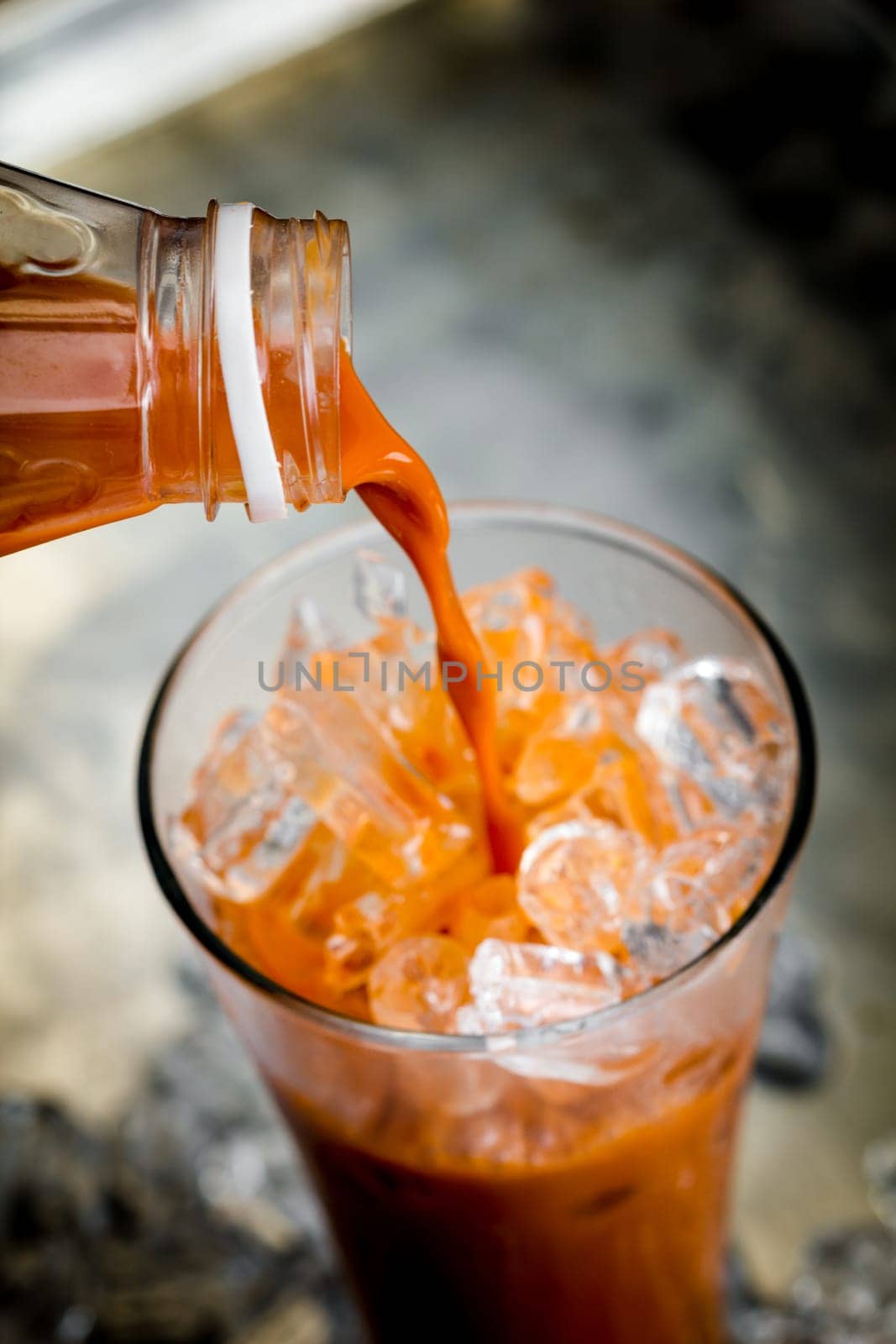 thai ice tea with milk in glass