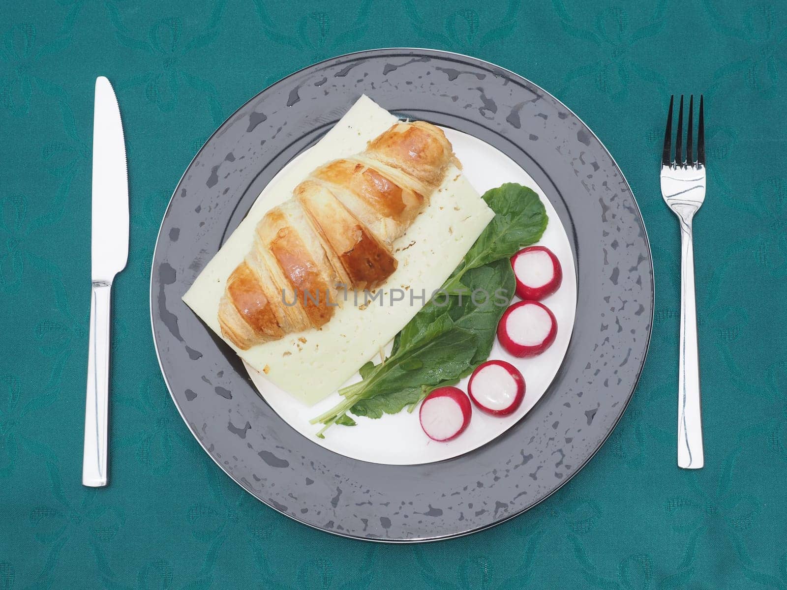 Cheese croissant on radishes