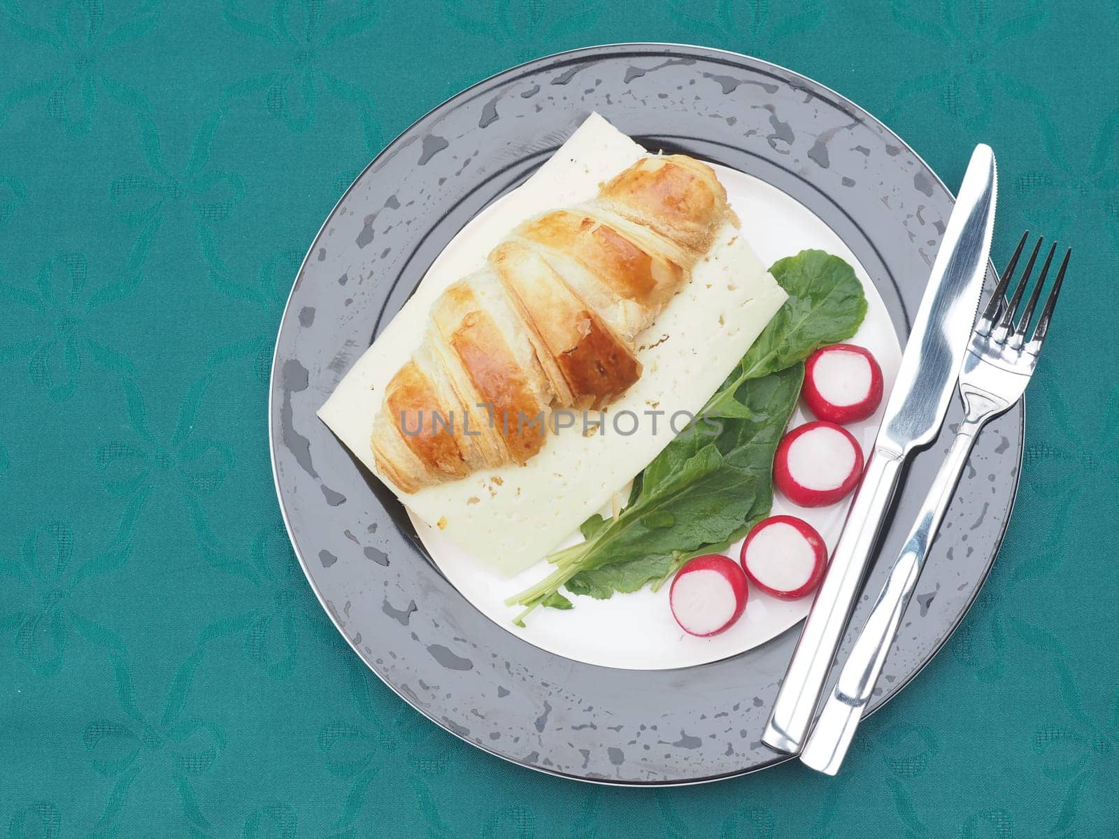 Cheese croissant on radishes