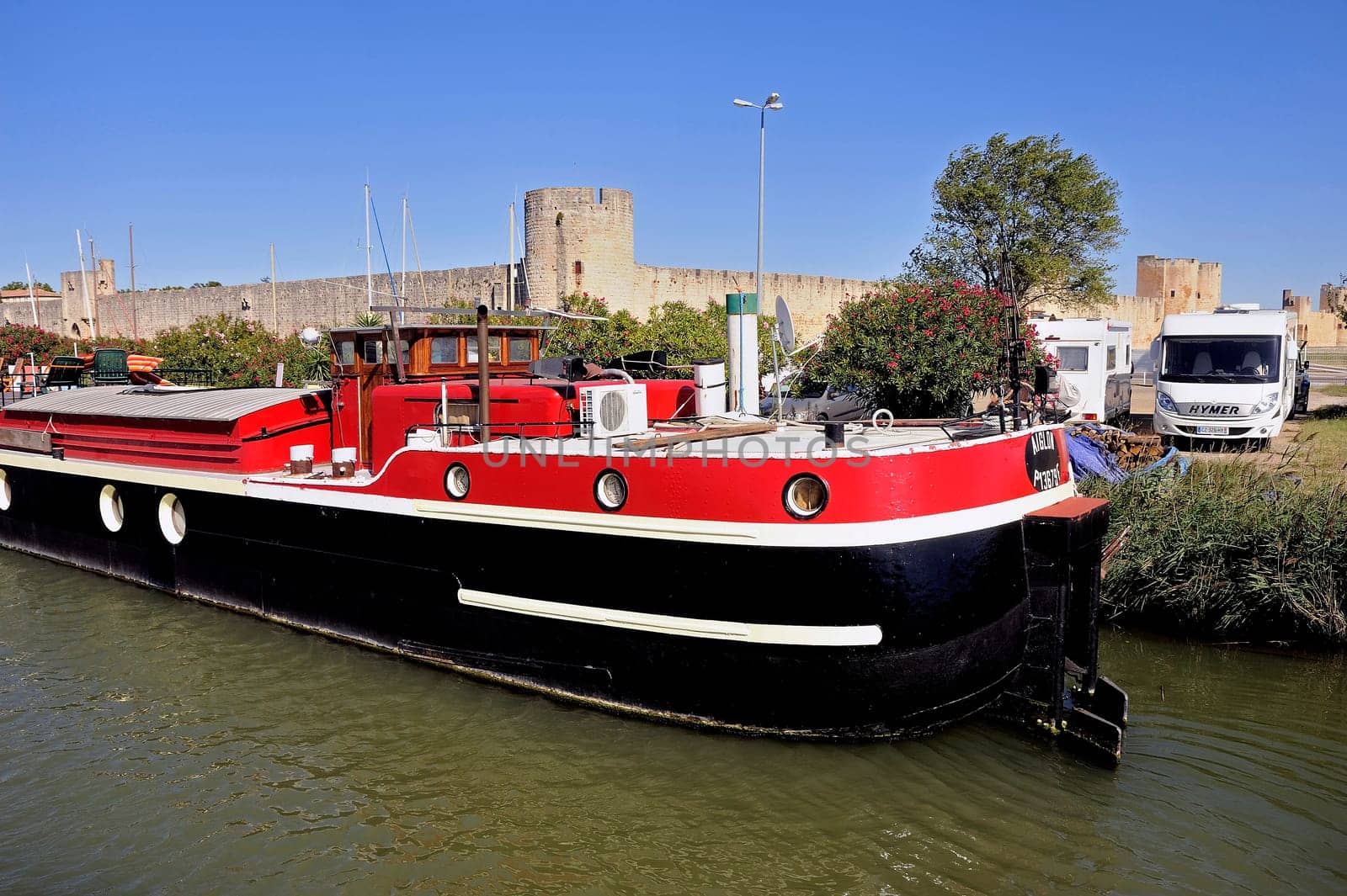 The marina of Aigues-Mortes in the background with the city walls.