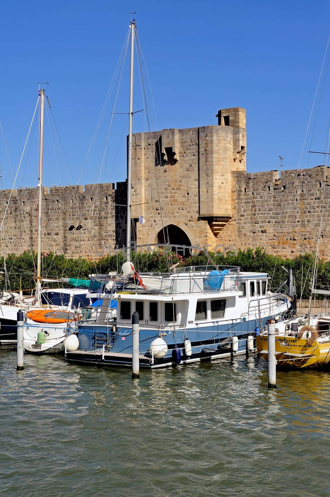 The marina of Aigues-Mortes in the background with the city walls.