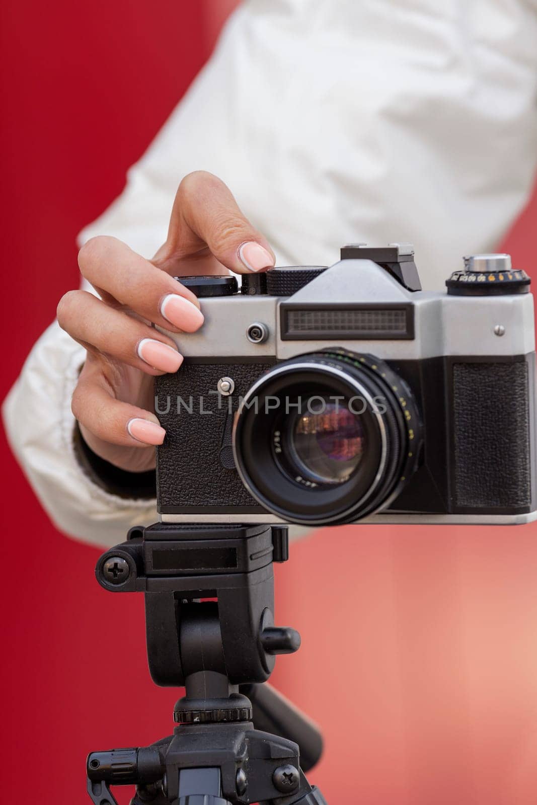 close-up of hand girl takes pictures for retro camera
