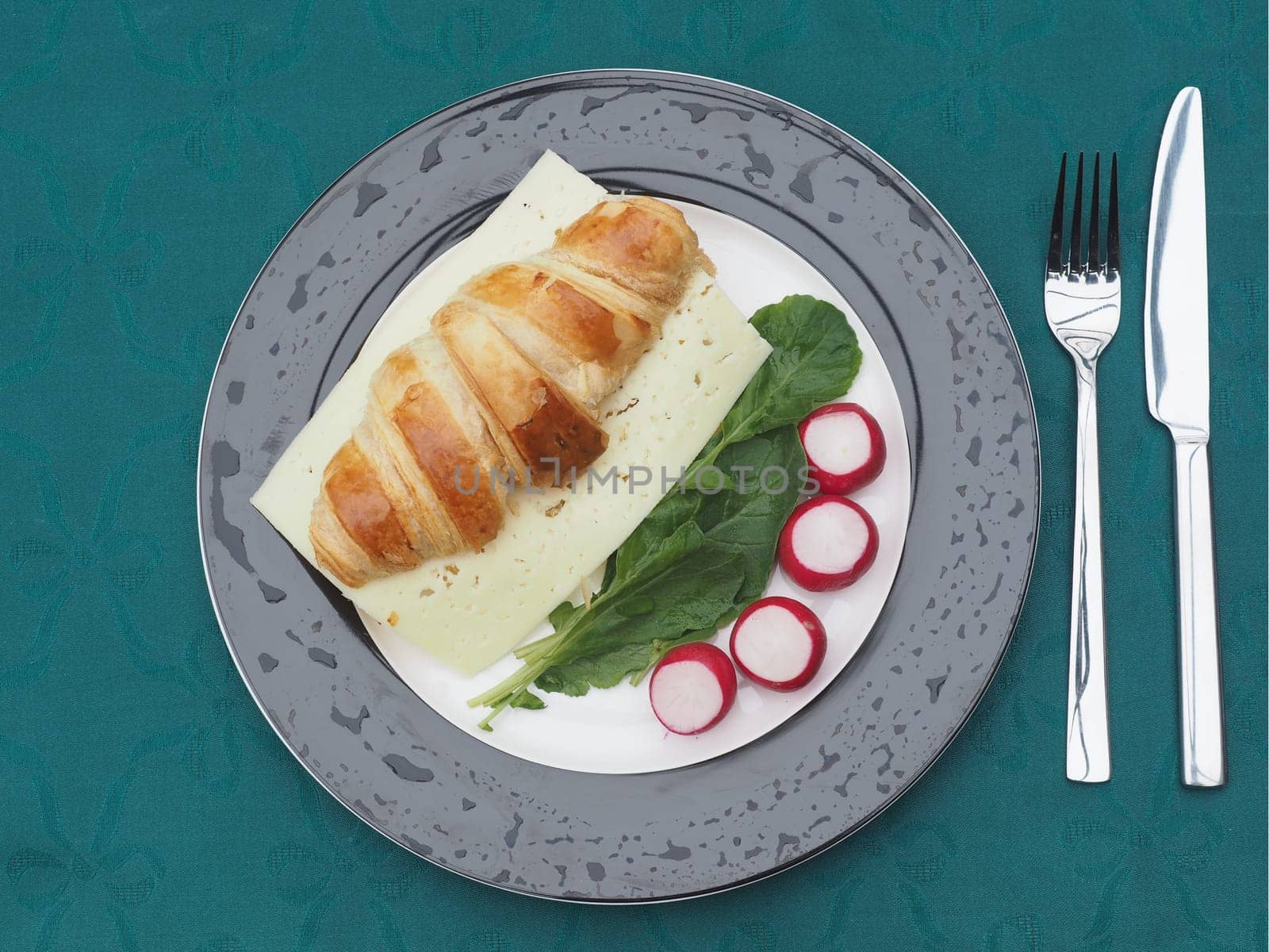 Cheese croissant on radishes