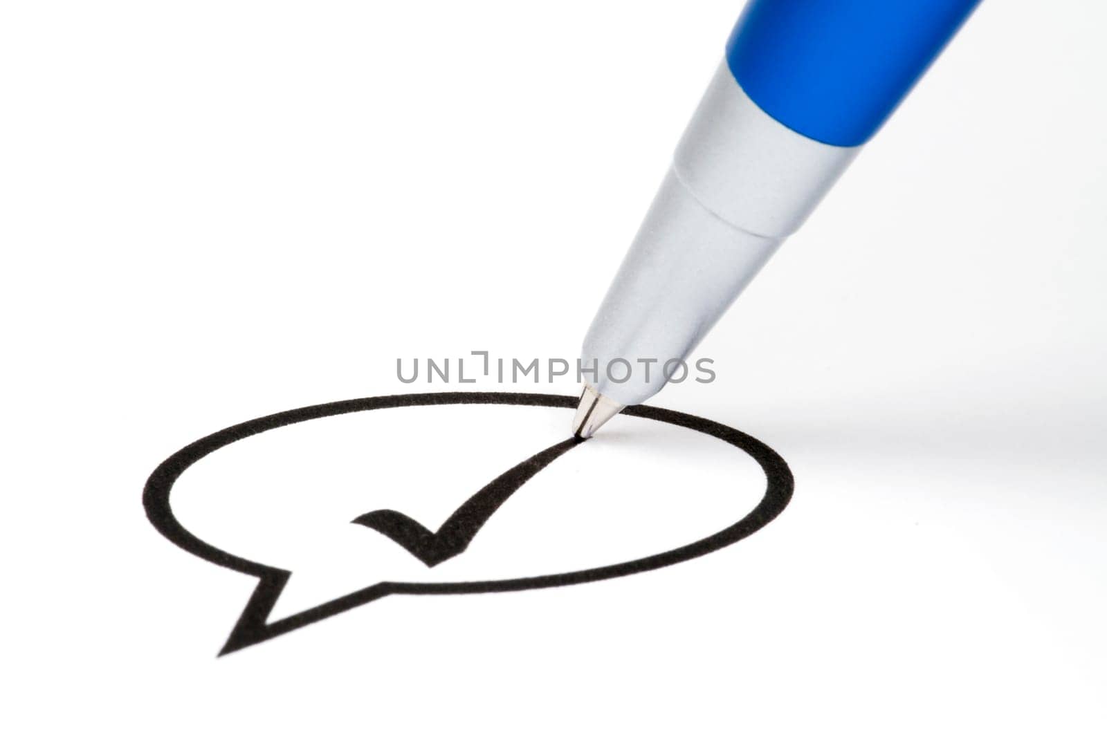 Pencil making a check sign in a balloon box. Isolated on white.