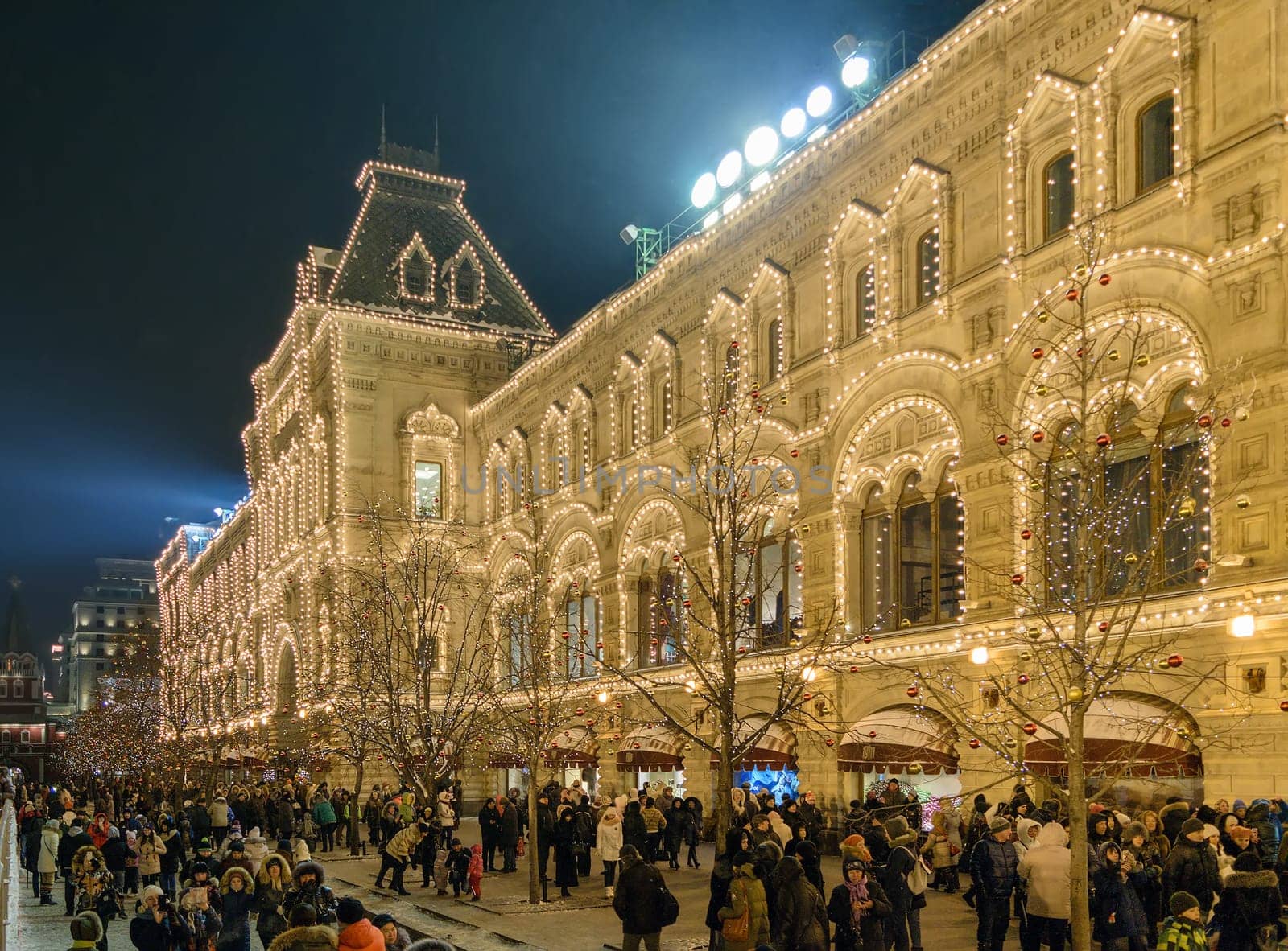 Moscow, Russia - January 05, 2016: People walk on Christmas Eve at the entrance of GUM on Red Square