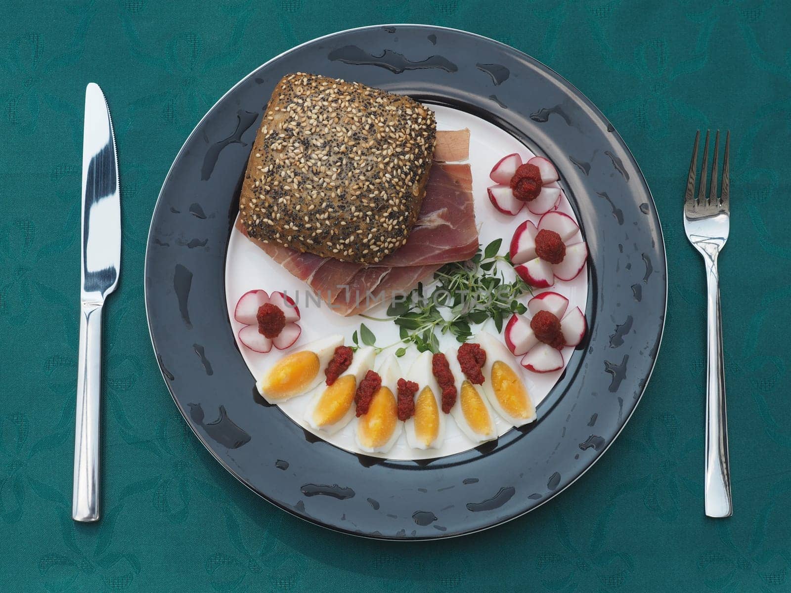 Serano ham rolls with egg and radishes