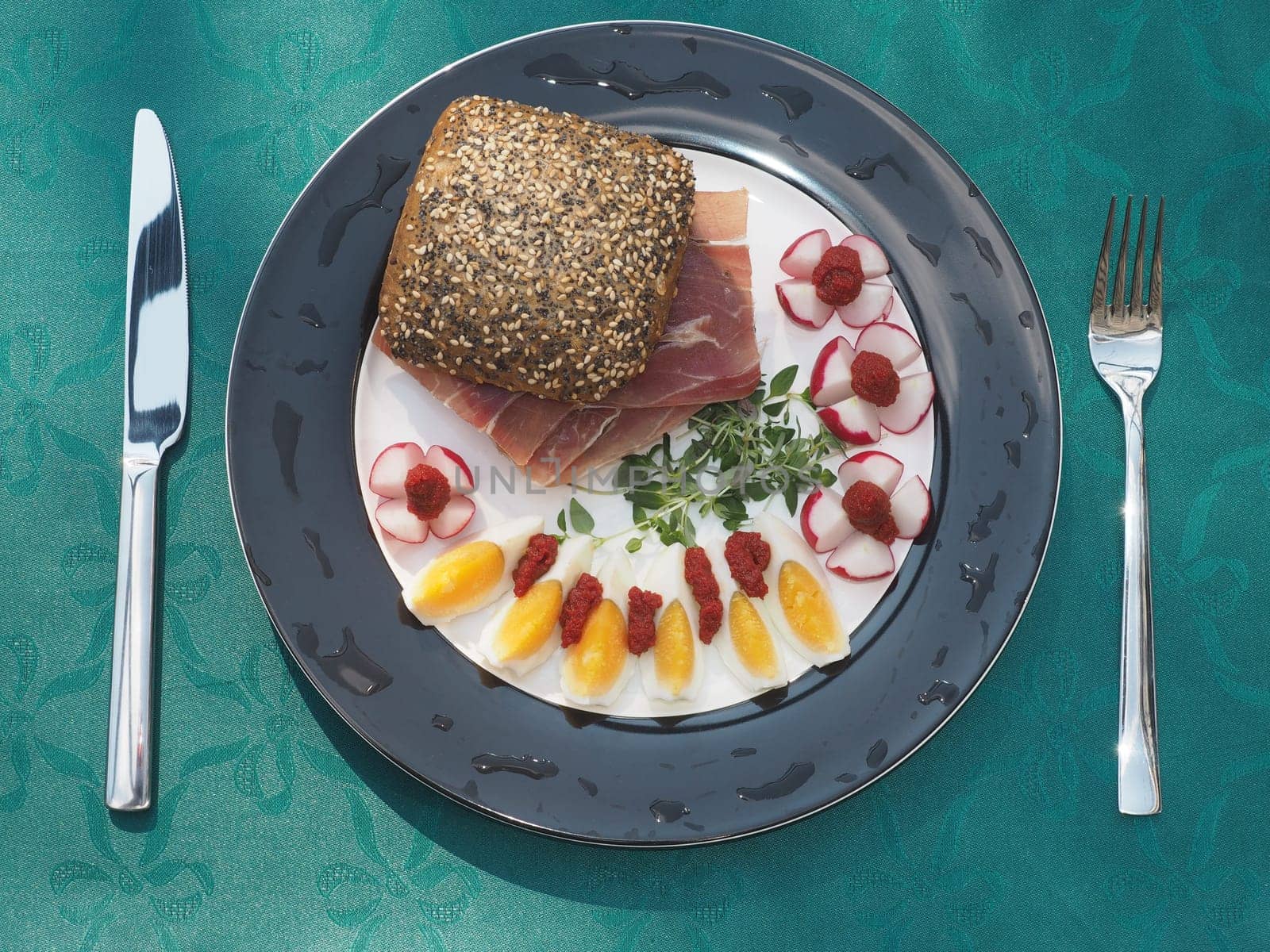 Serano ham rolls with egg and radishes