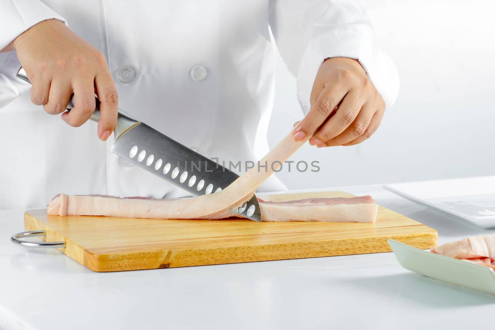 chef sliced streaky pork on cutting boards