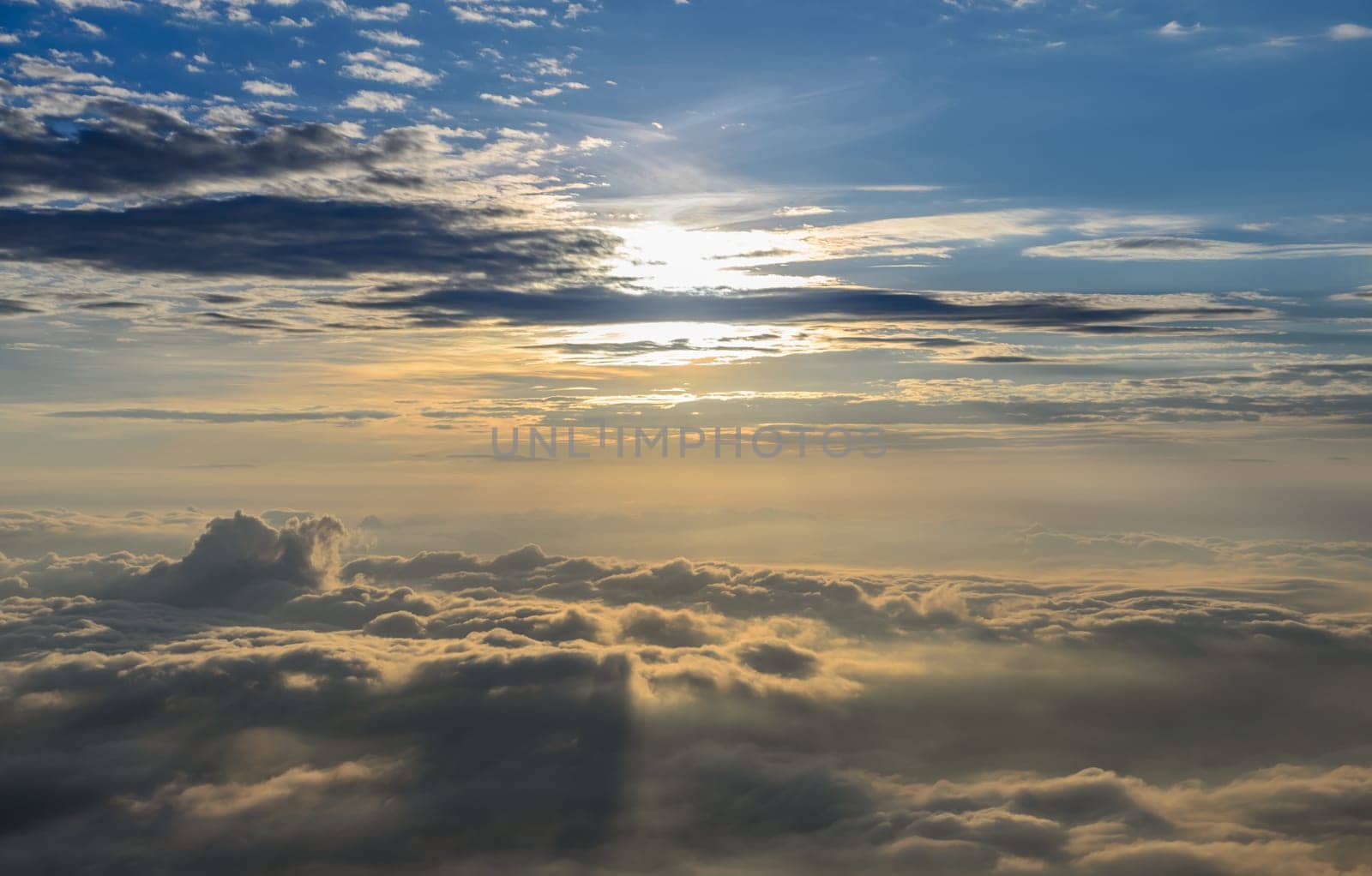 Beautiful nature landscape of rising sun in the early morning over sea of mist