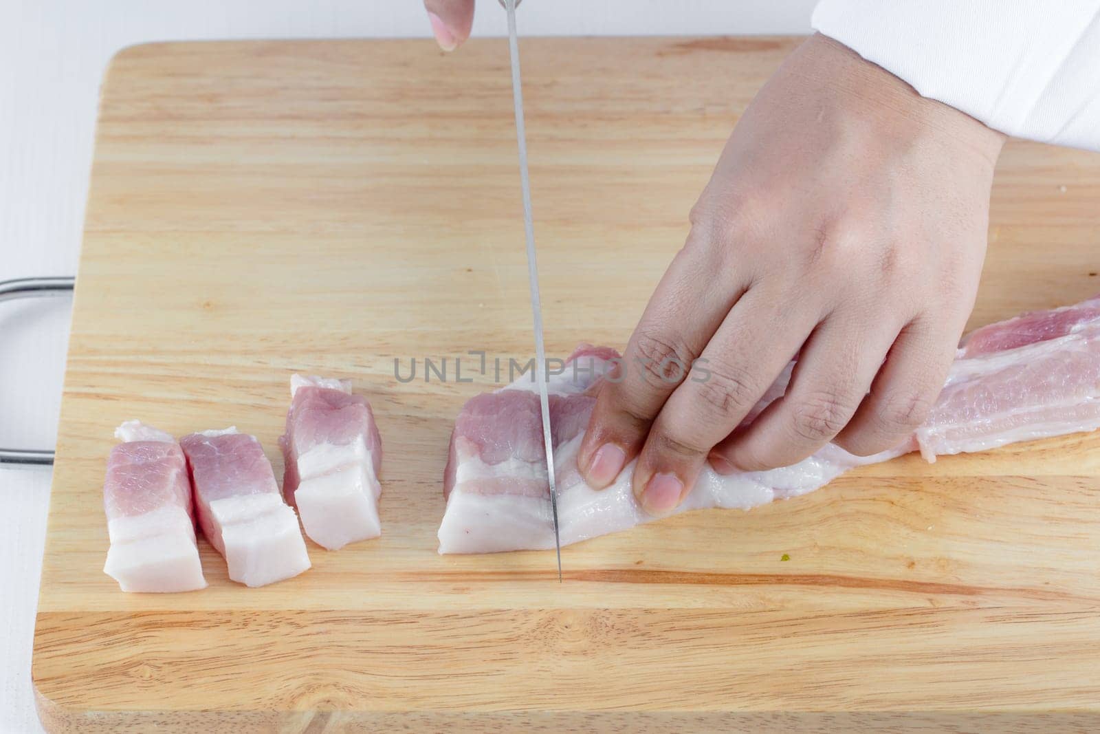 chef sliced streaky pork on cutting boards