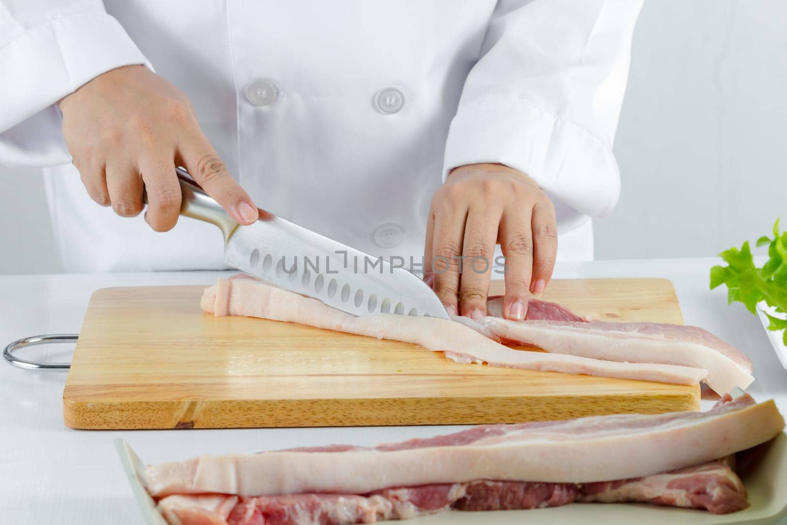 chef sliced streaky pork on cutting boards