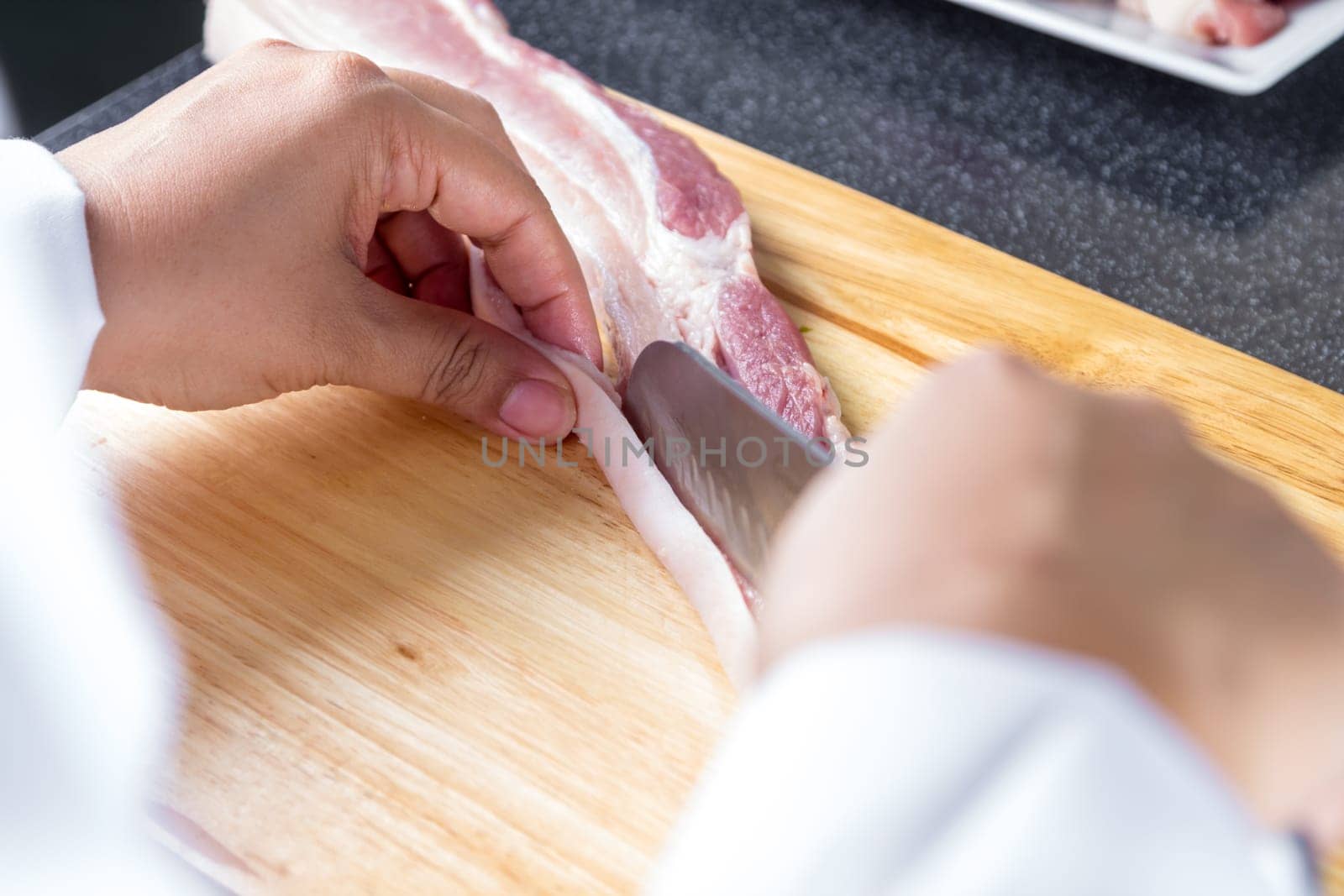 chef sliced streaky pork on cutting boards