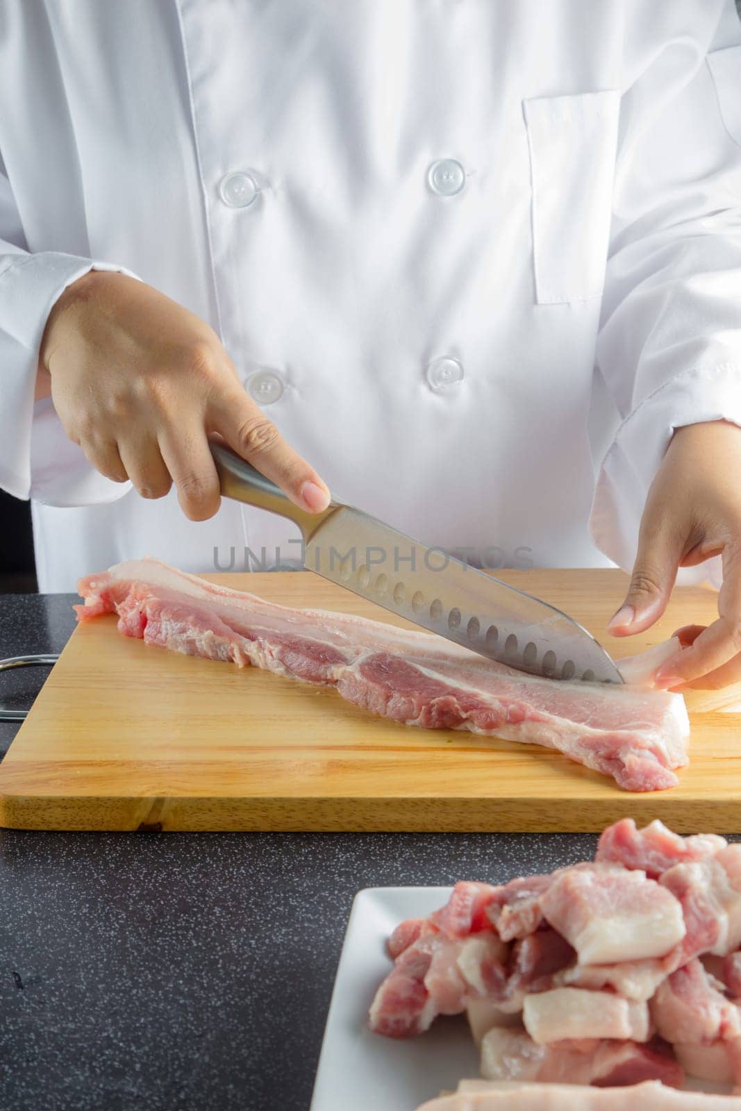 chef sliced streaky pork on cutting boards