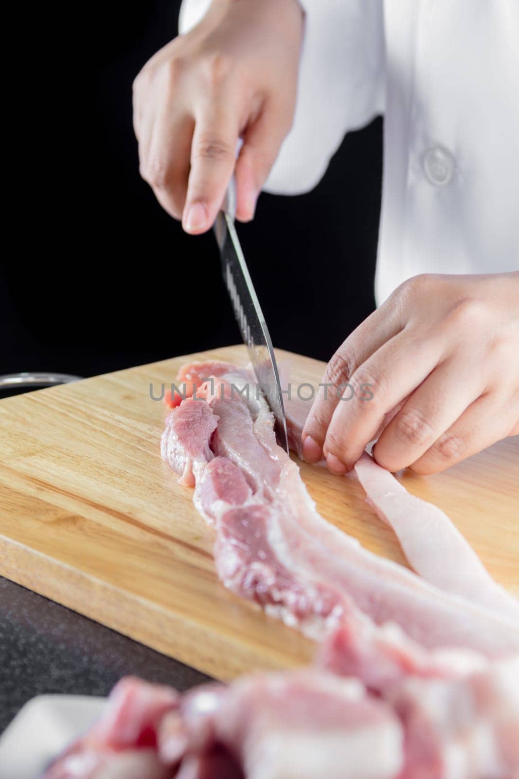 chef sliced streaky pork on cutting boards