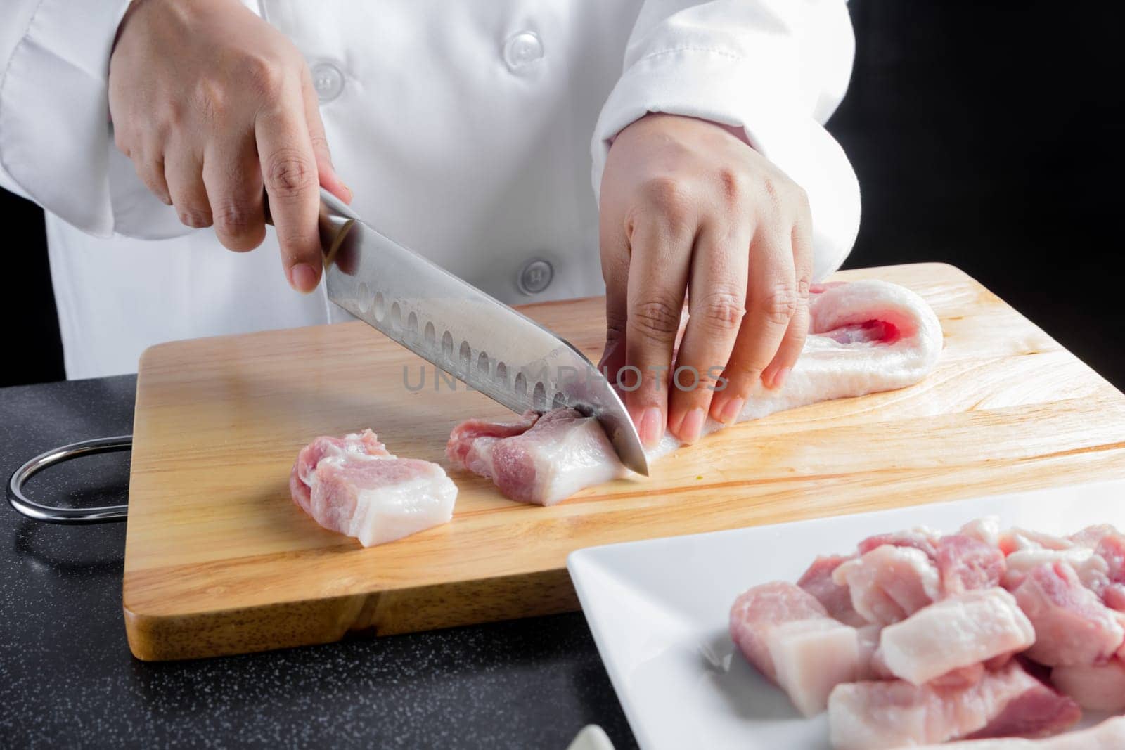 chef sliced streaky pork on cutting boards