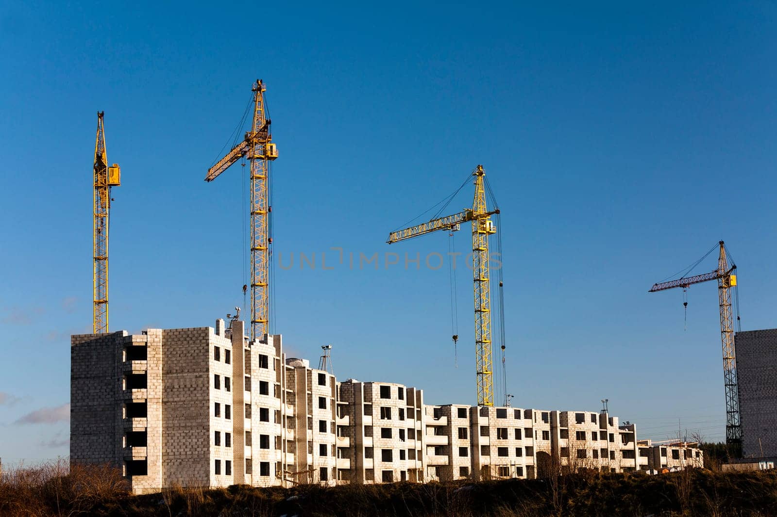 a construction site on which construction of a new multystoried house is carried out.