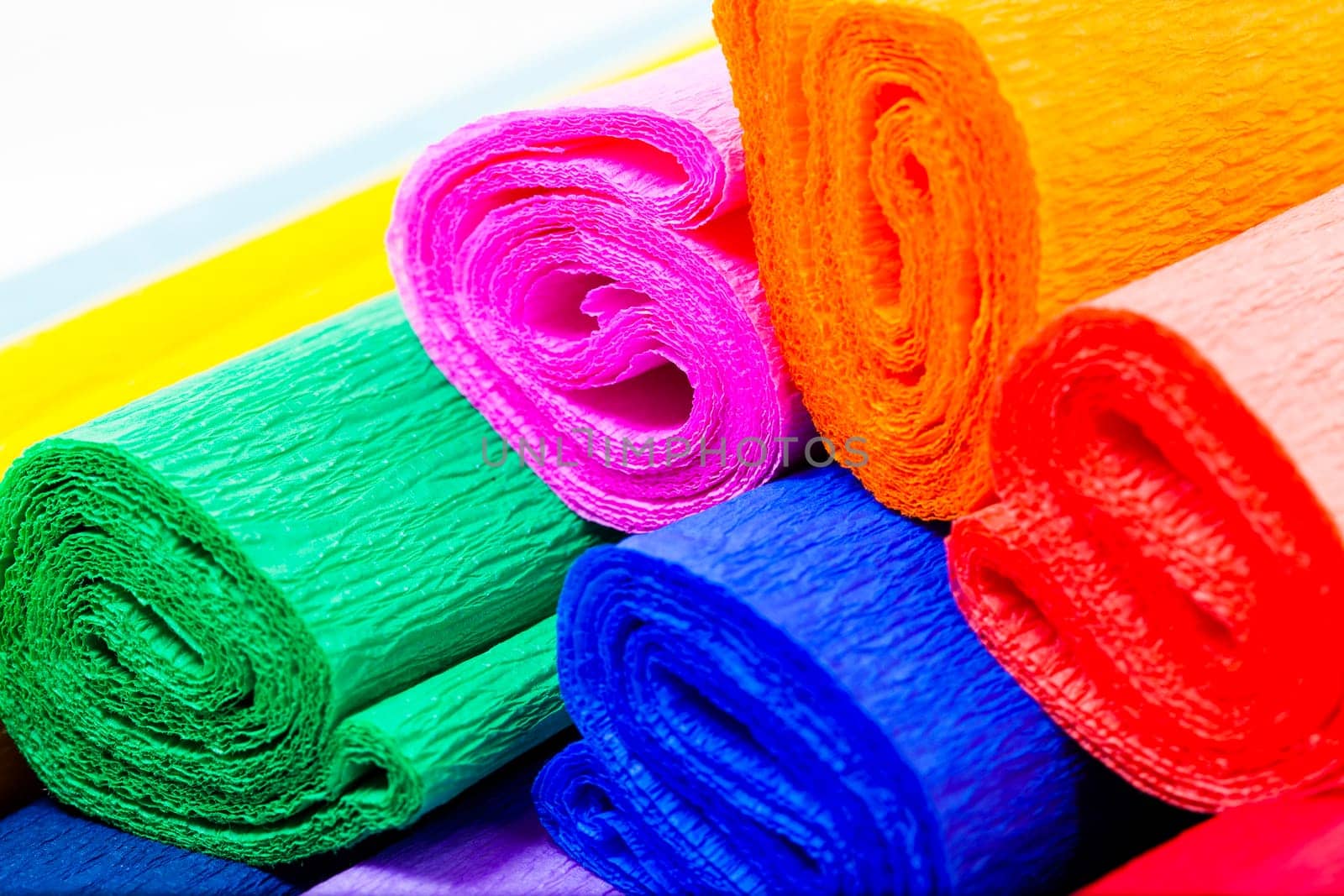a few rolls of crepe paper in different colors. Close-up.
