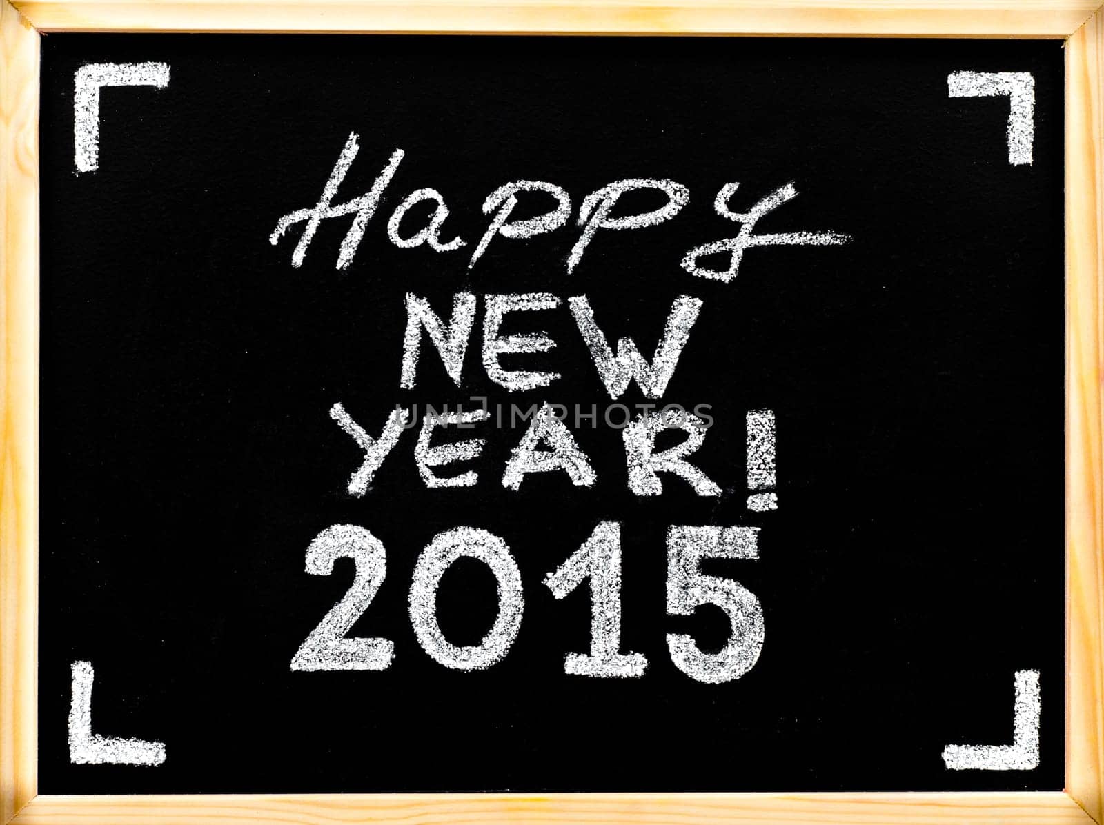 Happy new year 2015, hand writing with chalk on wooden frame blackboard, vintage concept