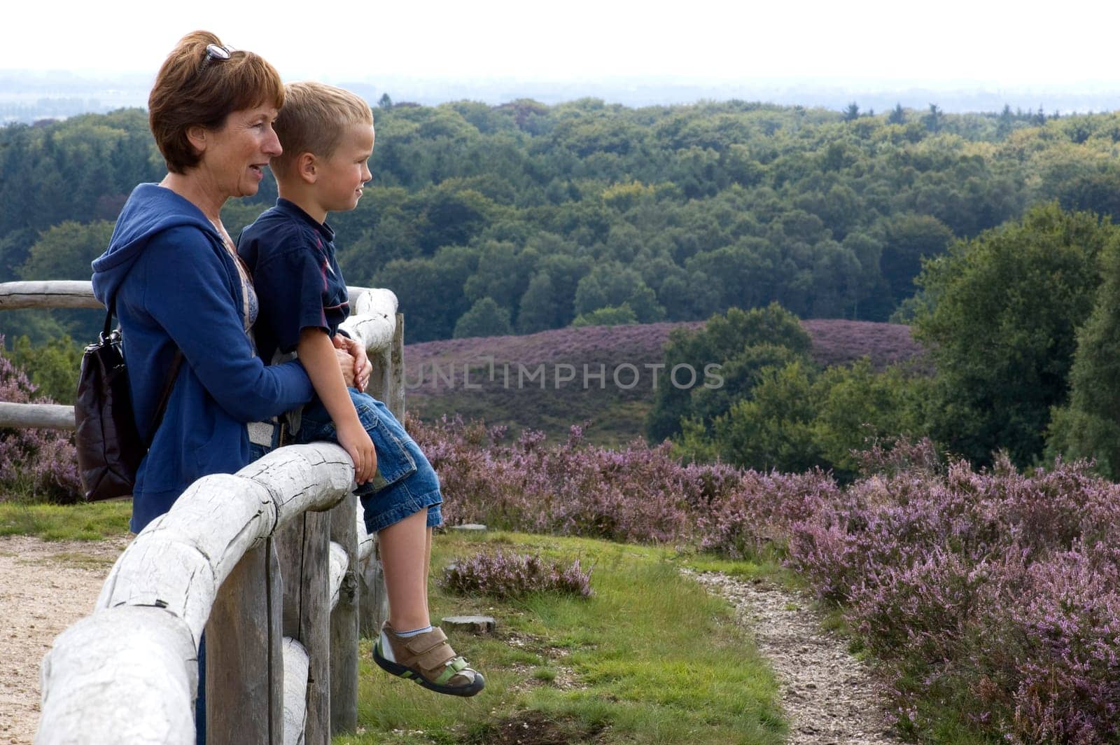 Grandma and grandson looking at a beautiful landscape.