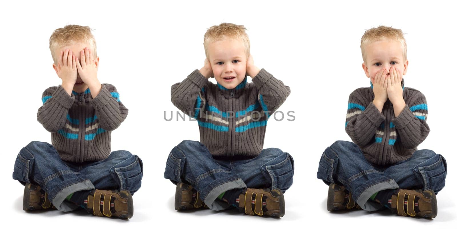 Young boy playing don't see, don't hear, don't speak.
