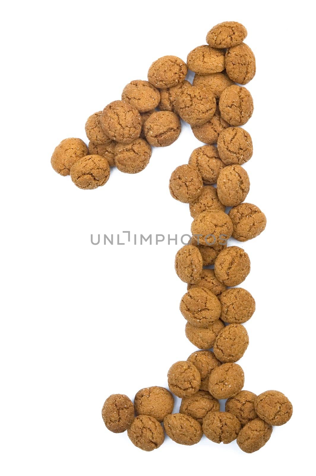 Little ginger nuts in the form of the digit one. These little ginger nuts are used in Holland for the "Sinterklaas"" party, which is at Dec 5 every year. Sinterklaas is a sort of Santa Claus. In Holland these ginger nuts are called ""pepernoot"". Isolated on white."