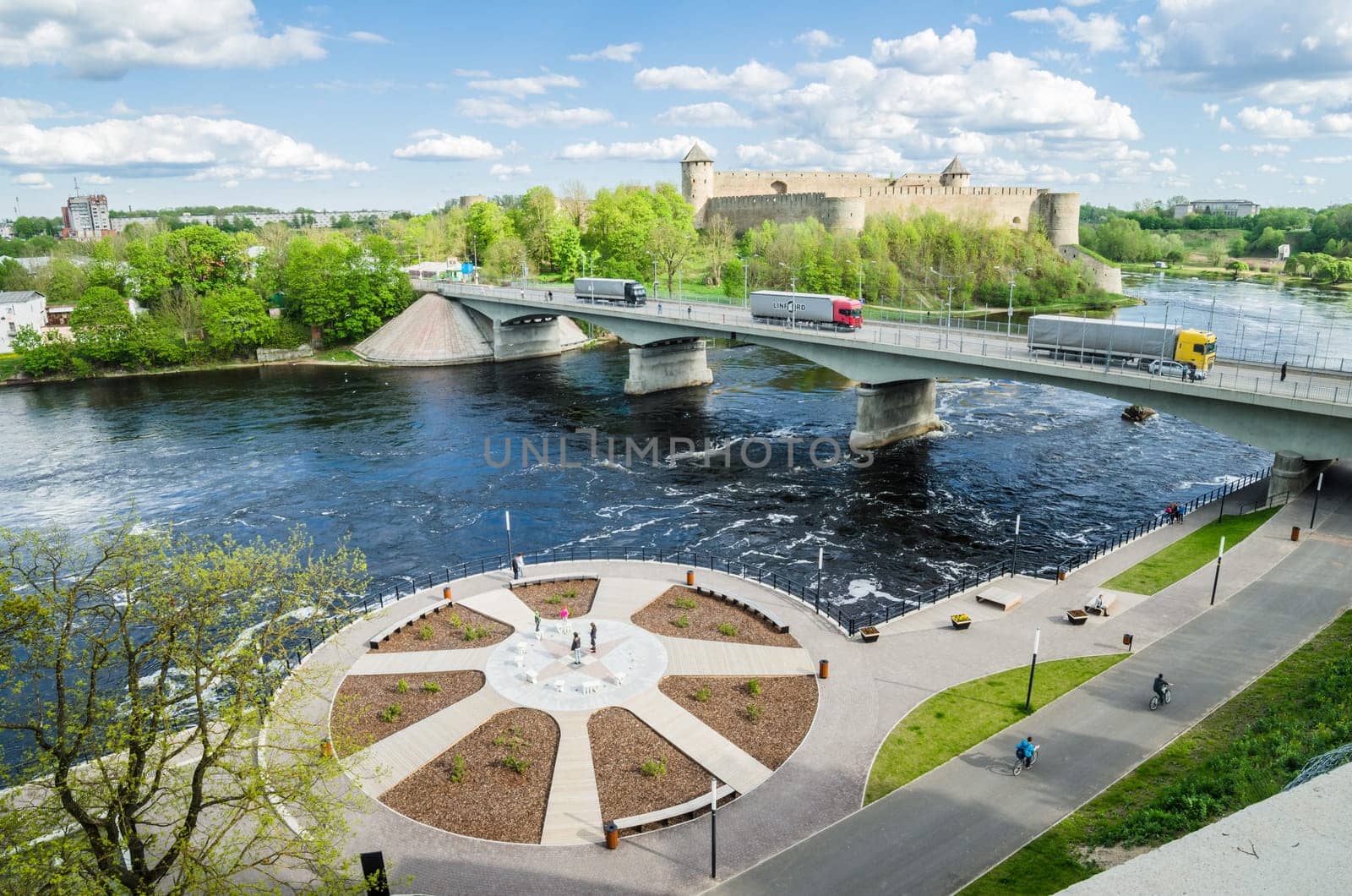 NARVA, ESTONIA - MAY 22 2015: Narva river embankment and a beautiful view of the Ivangorod Fortress and the border of Russia and the European Union