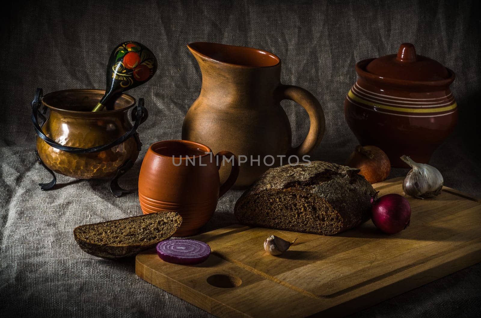 Still life with homemade bread and pottery