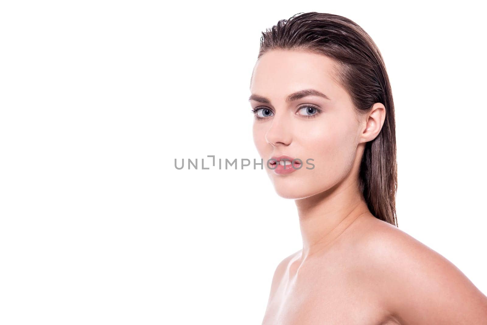 Beautiful young woman with bare shoulders over white background