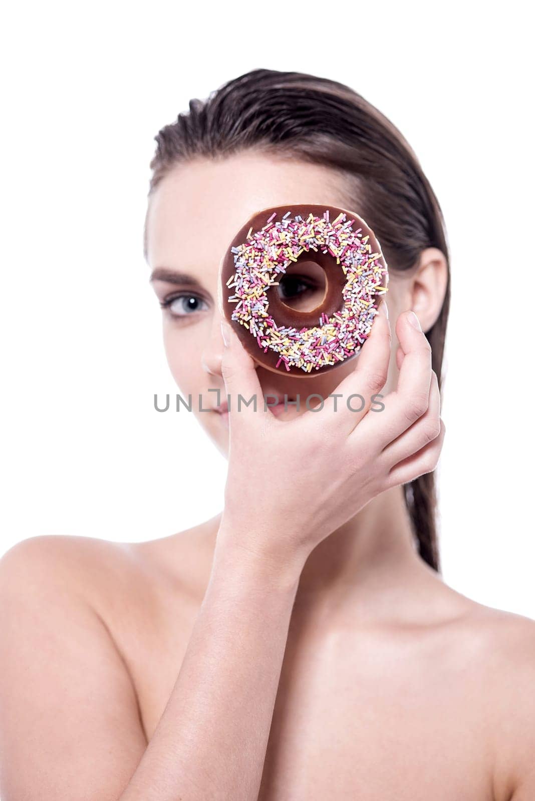 Young woman facing the camera through a dessert