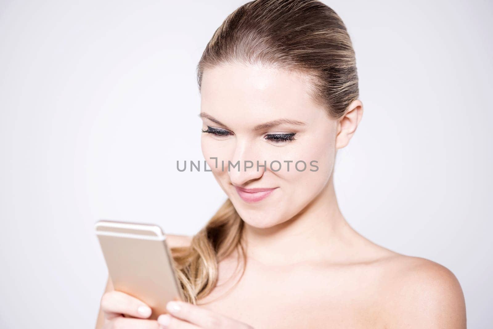 Gorgeous woman with a touch screen phone