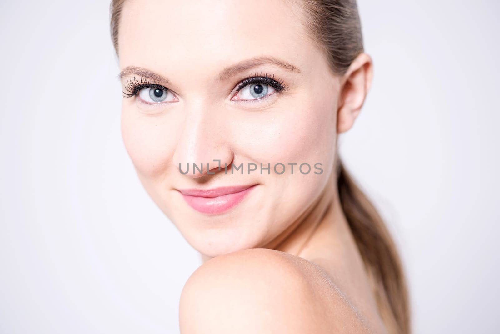 Topless model facing towards camera
