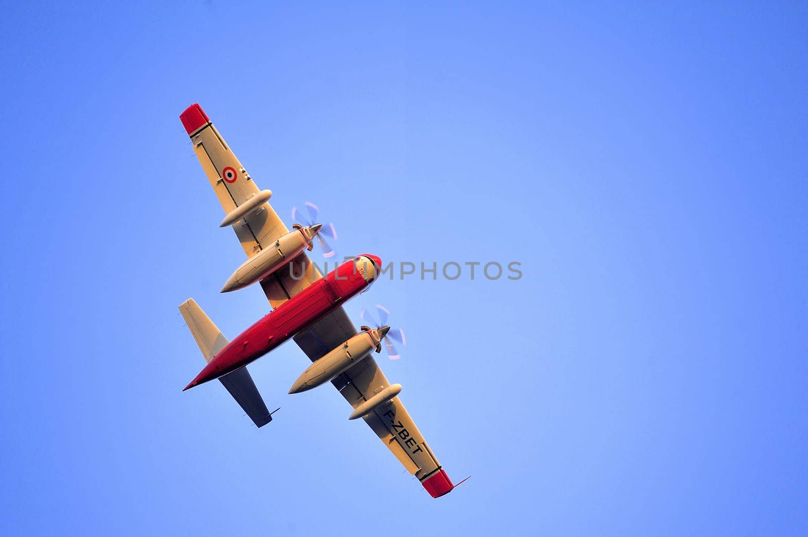 Tracker water bomber in the sky of southern France from extinguishing a forest fire.
