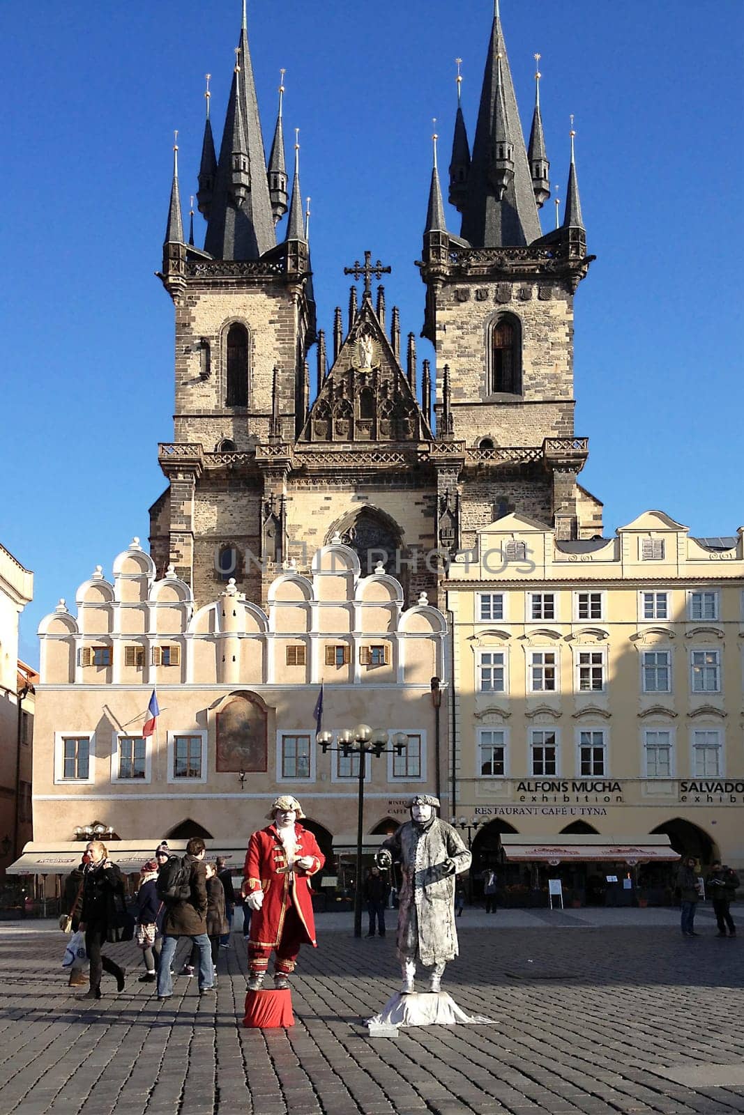 PRAGUE, CZECH REPUBLIC - NOVEMBER 13, 2012 - Live statues street artists perform in front of the Church of Our Lady before Tyn at the Old Town Square of Prague in the Czech Republic.