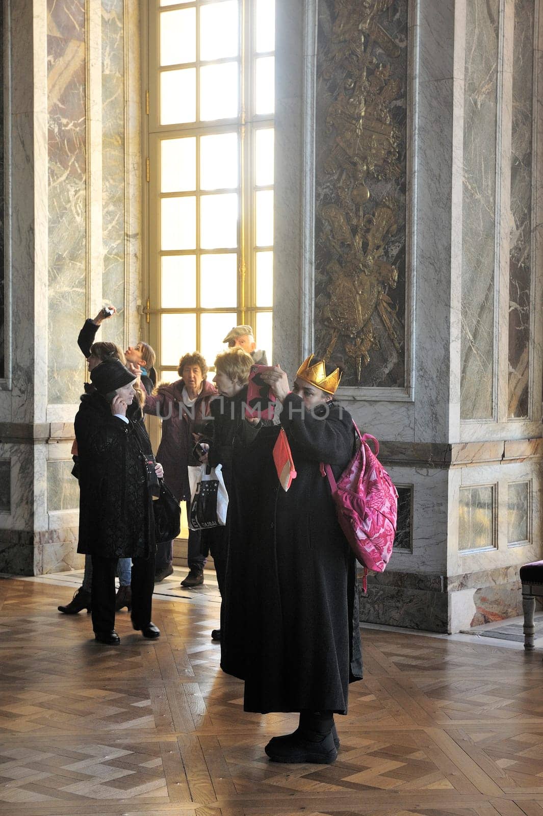 tourists visiting the castle of Versailles