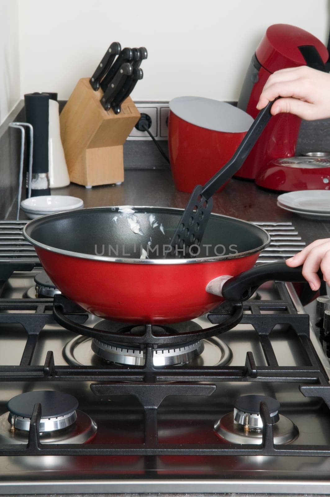 Detail of a cooking pan in a modern kitchen
