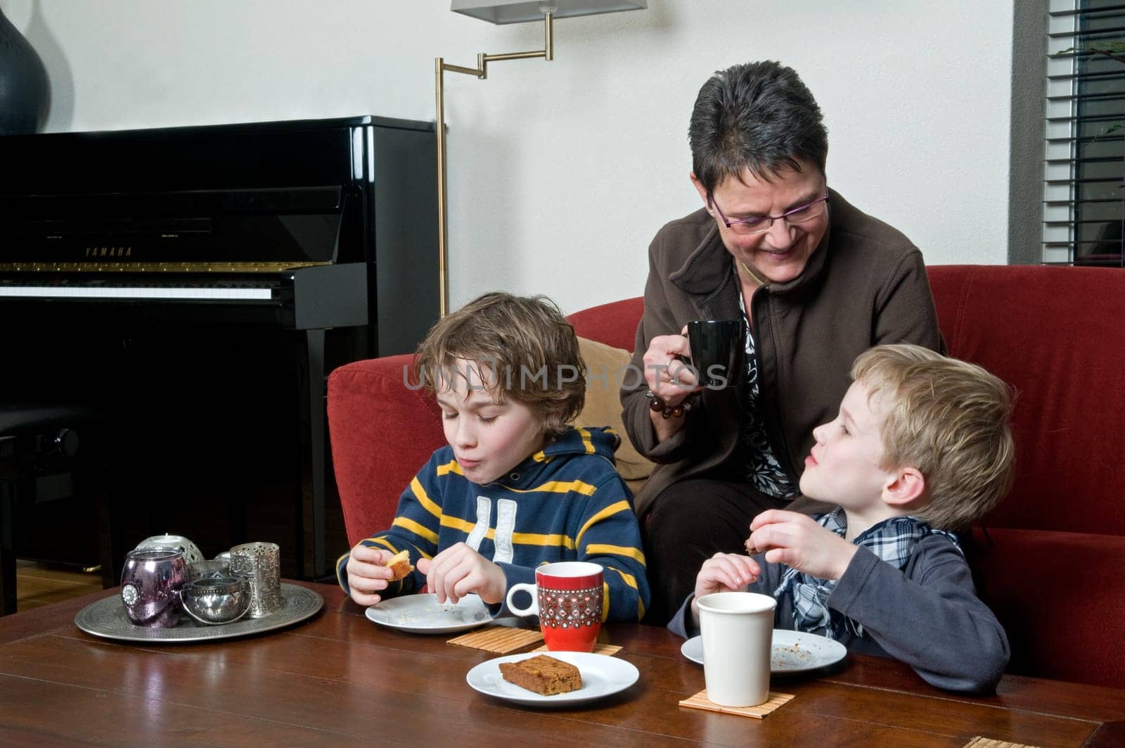 Family with two brothers and grandma in a livingroom
