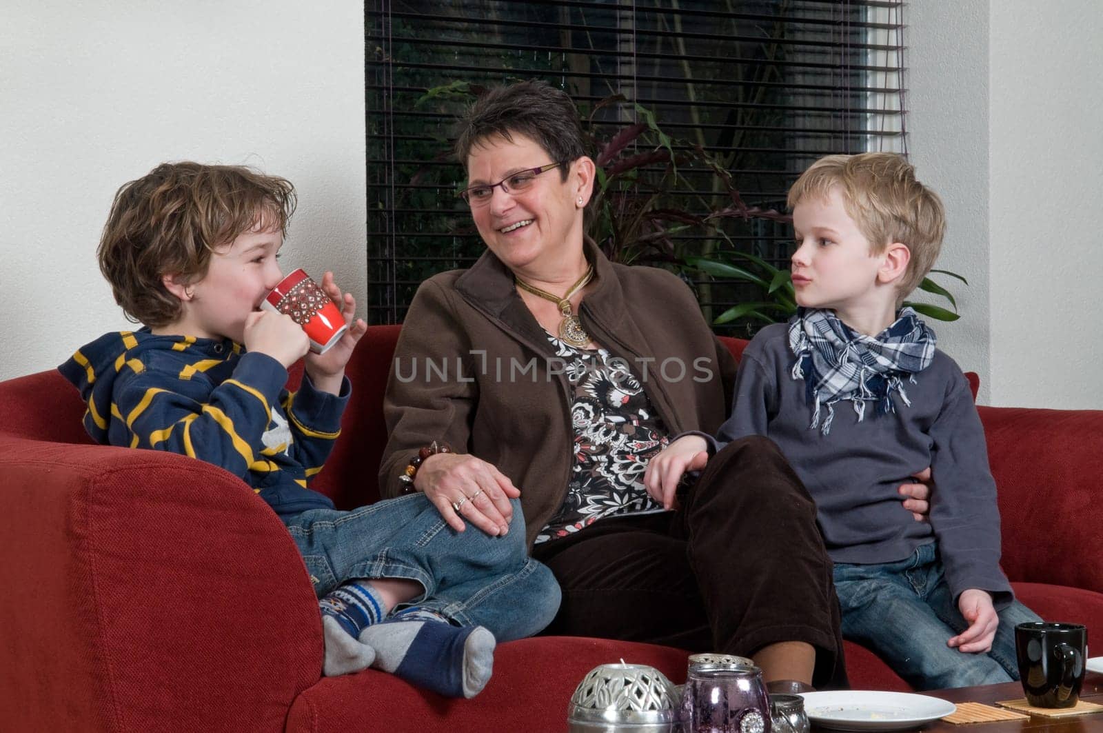 Family with two brothers and grandma in a livingroom