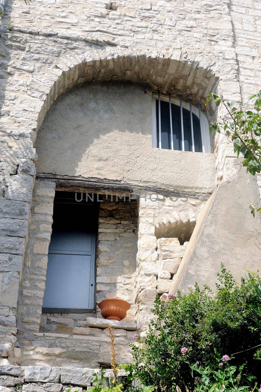 Facade of an old house in the village of Vezenobres in the French department of Gard