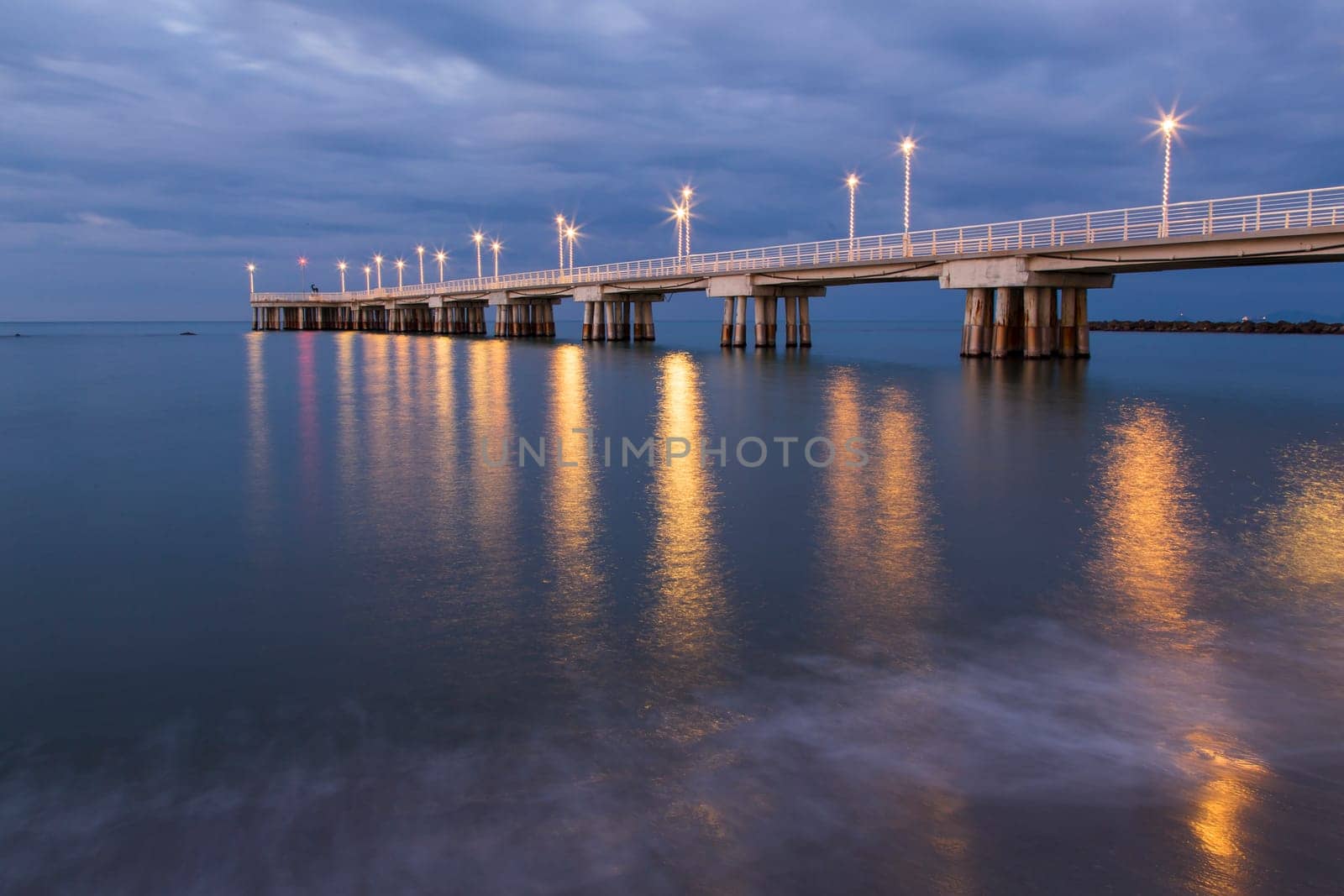 Panoramic view of a pier decorated with Christmas lights