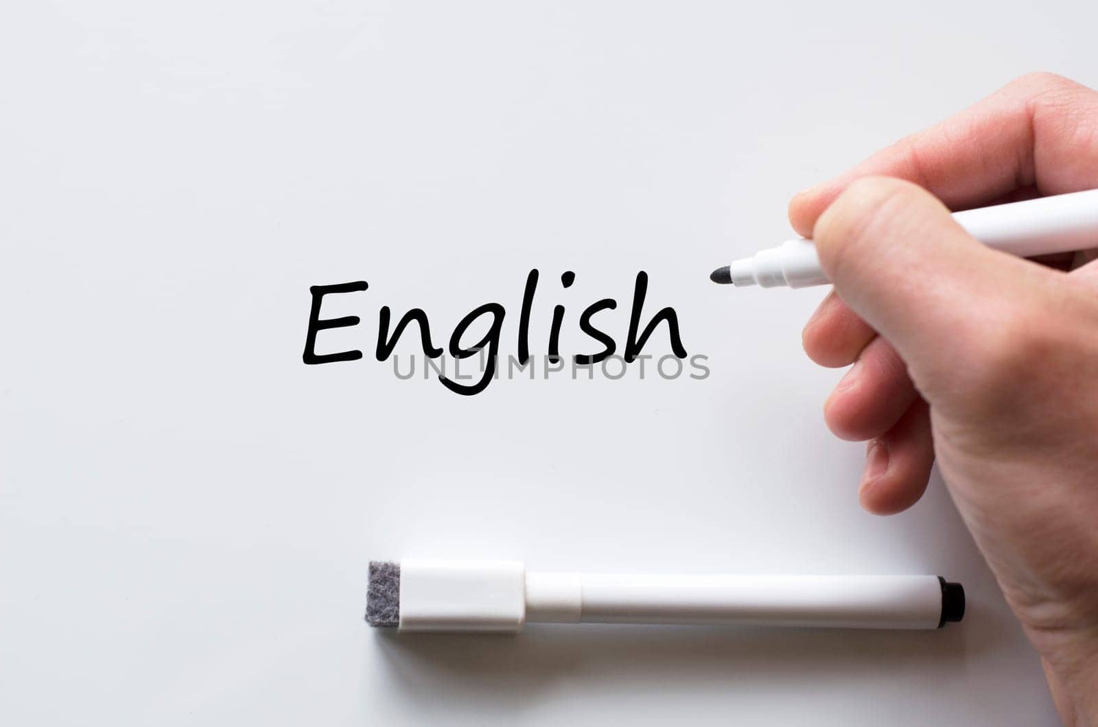 Human hand writing english on whiteboard