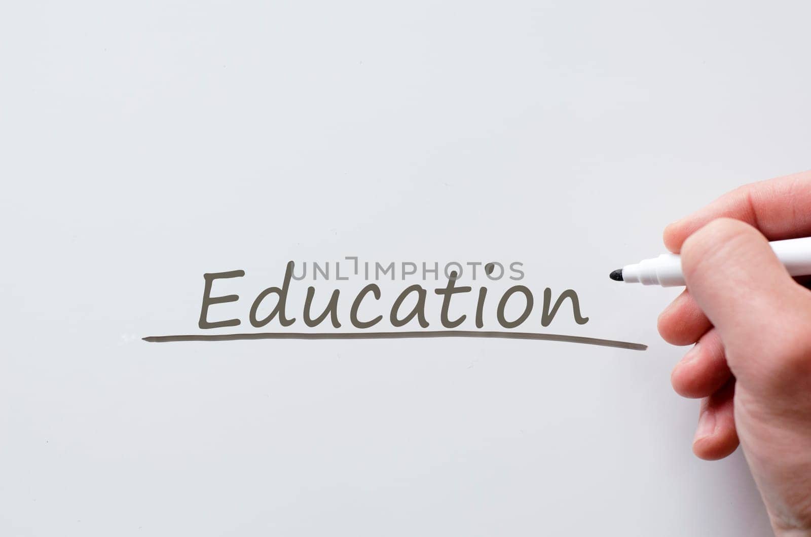 Human hand writing education on whiteboard