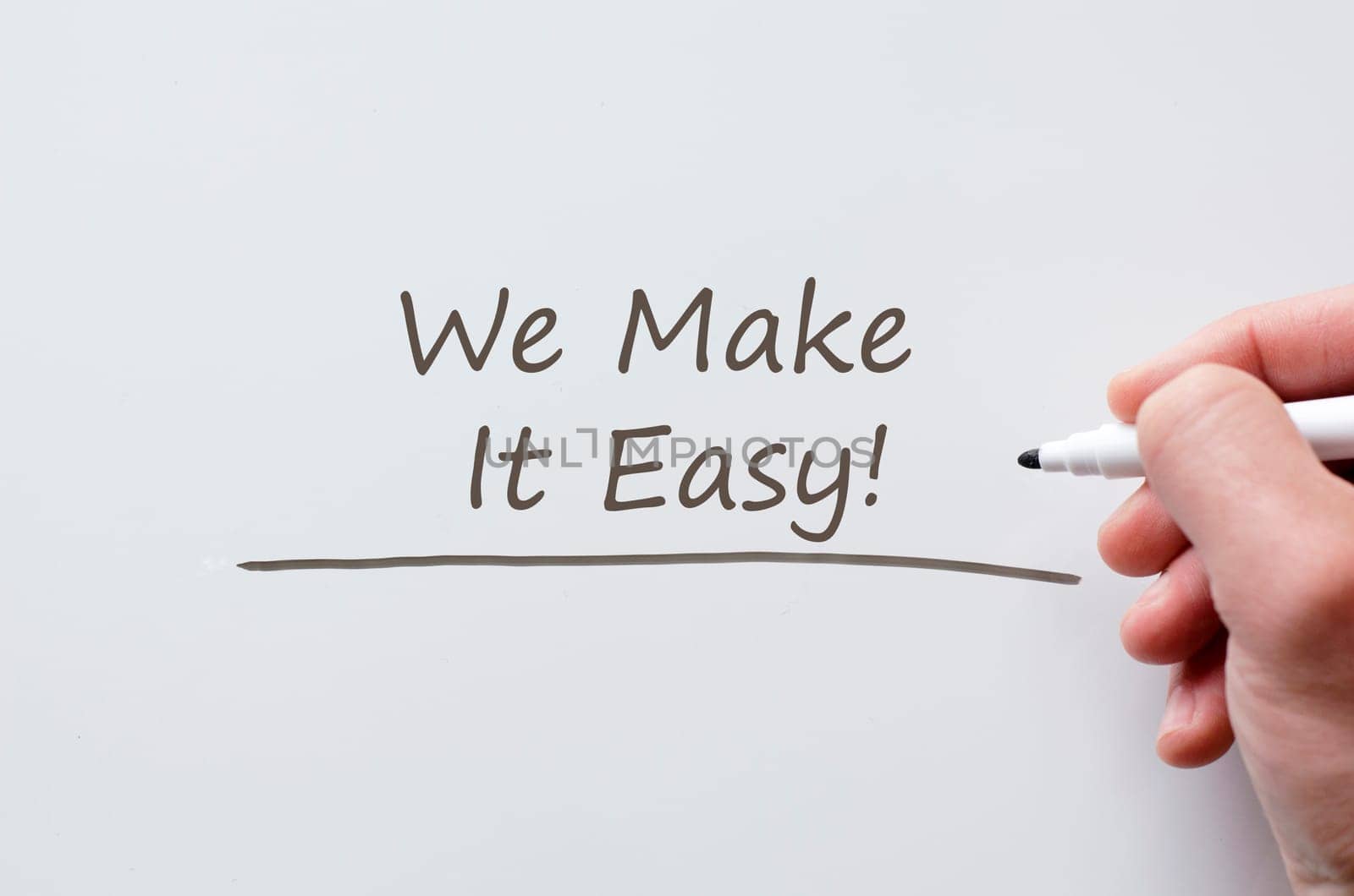 Human hand writing we make it easy on whiteboard